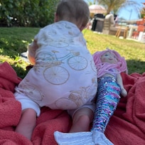 The grass was so soft, our grandbabies fell asleep in the cool shade. The property has a beautiful private hedge to make the backyard feel like a private oasis.