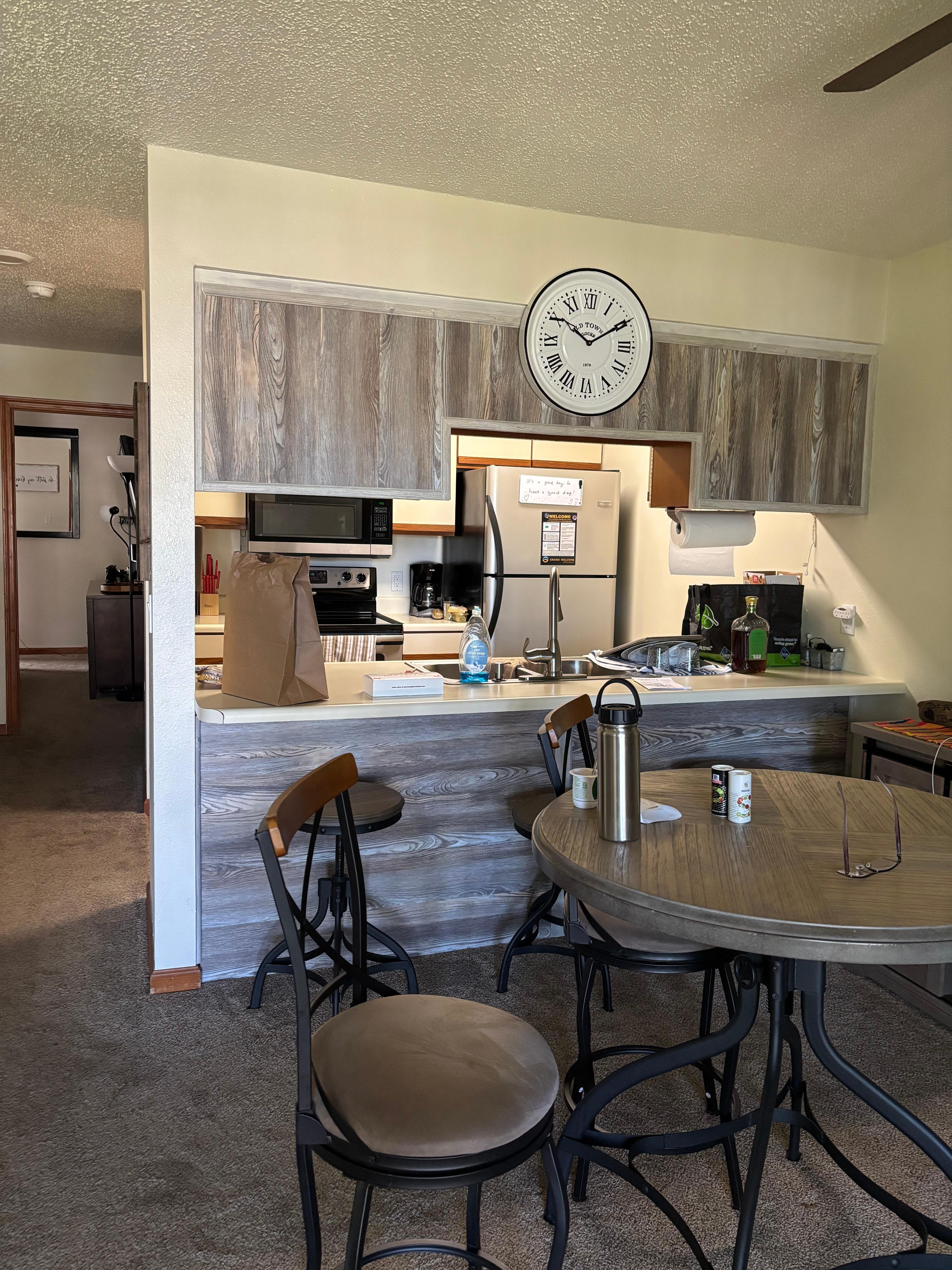 Galley kitchen with bar stools for extra seating if needed.