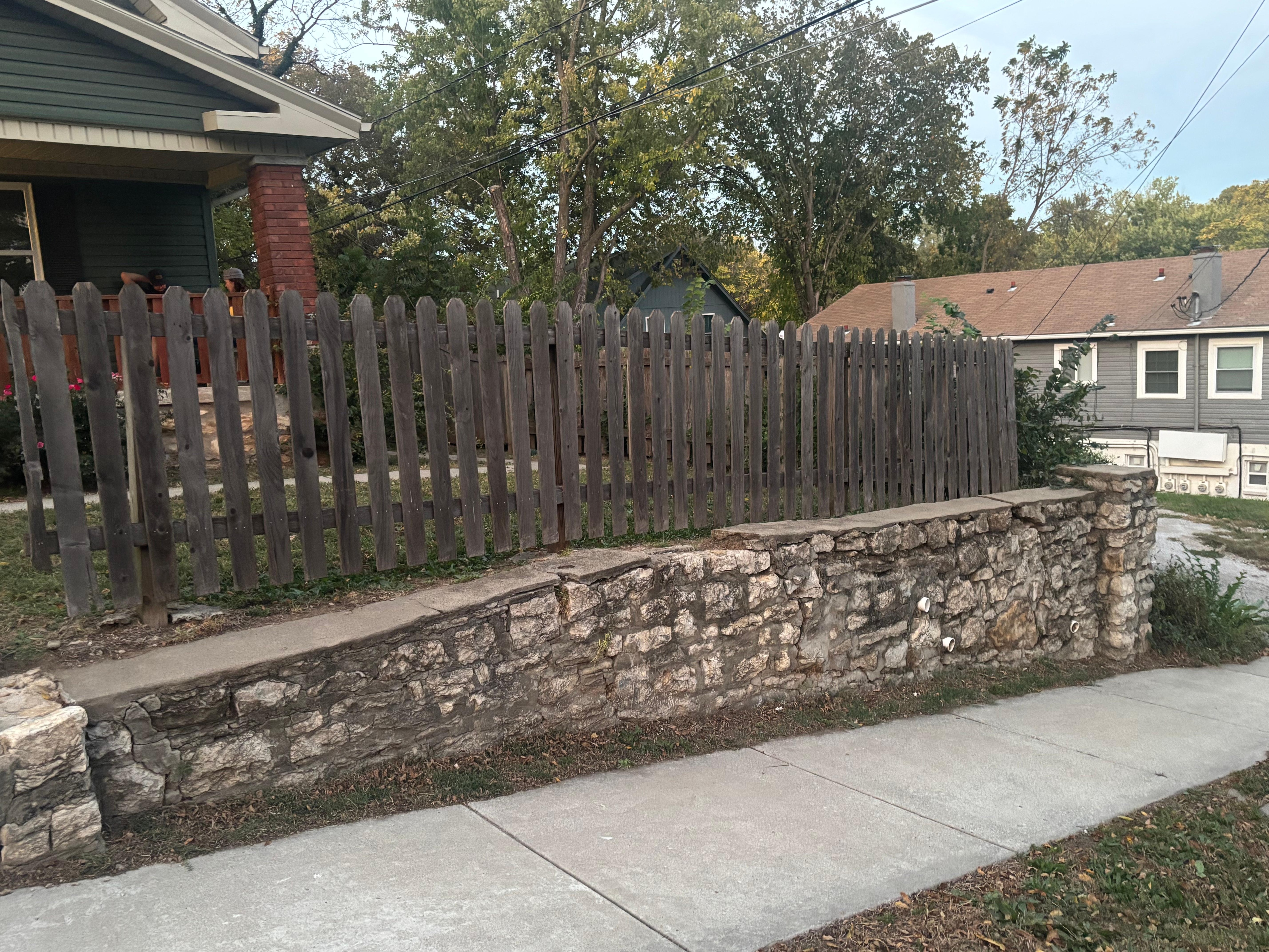 The beautiful rock wall bordering the street