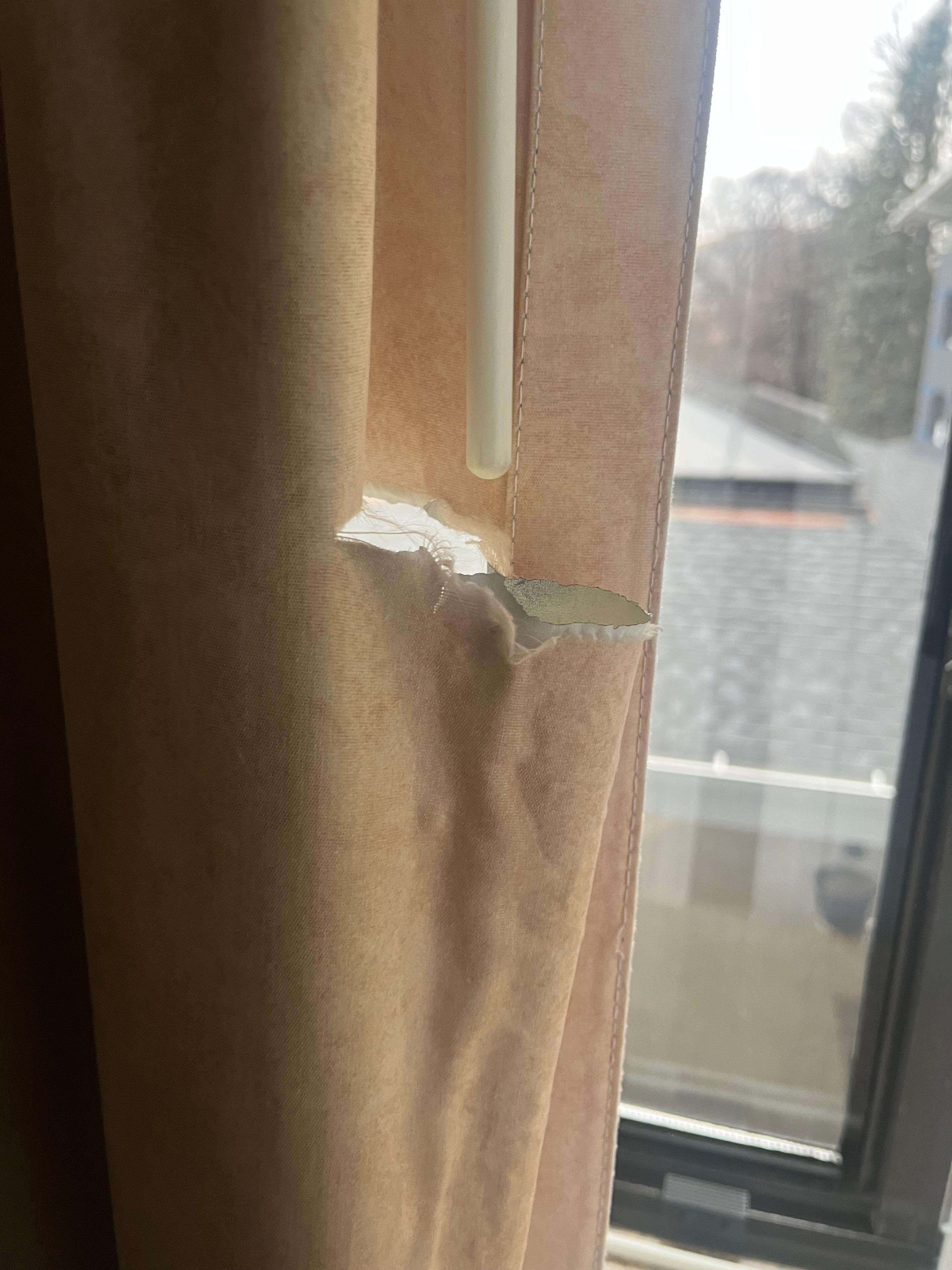 The curtains were torn. 