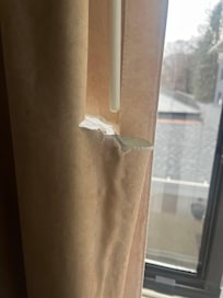 The curtains were torn.