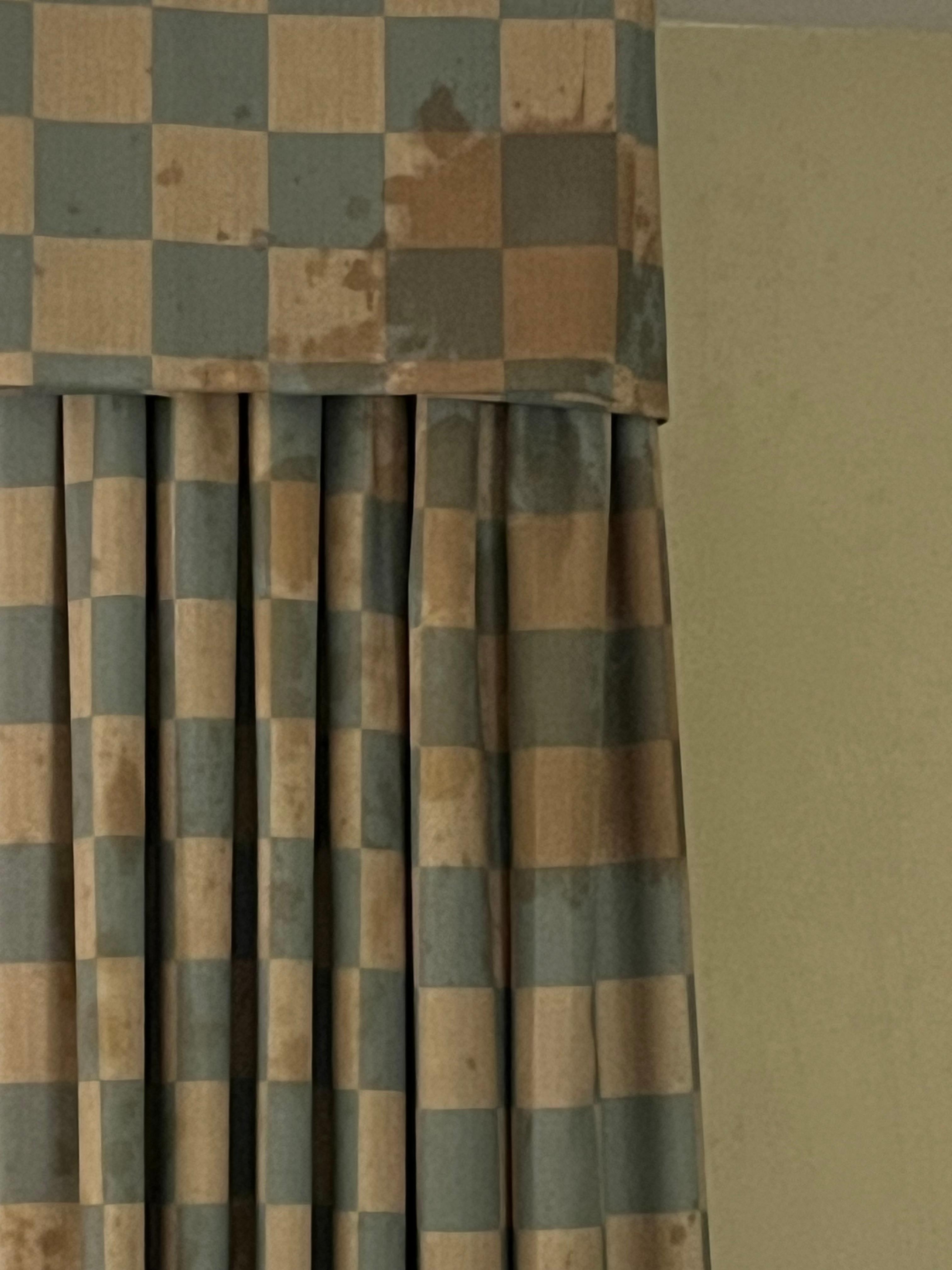 Stained and dirty curtains in the hotel room. 