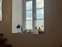 Windows of the living room at sunset.