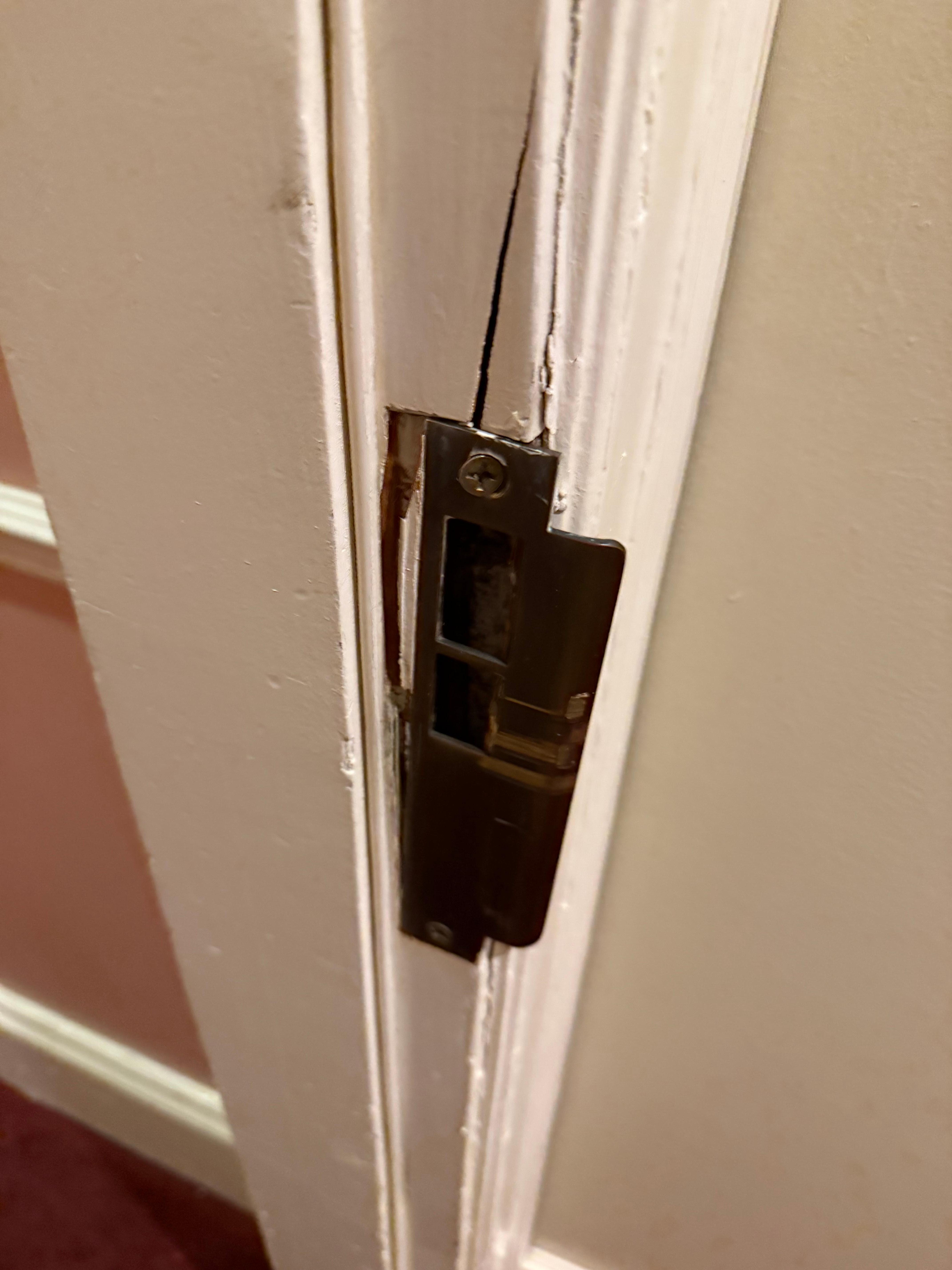 The latch for the hotel rooms door is broken and unsafe.