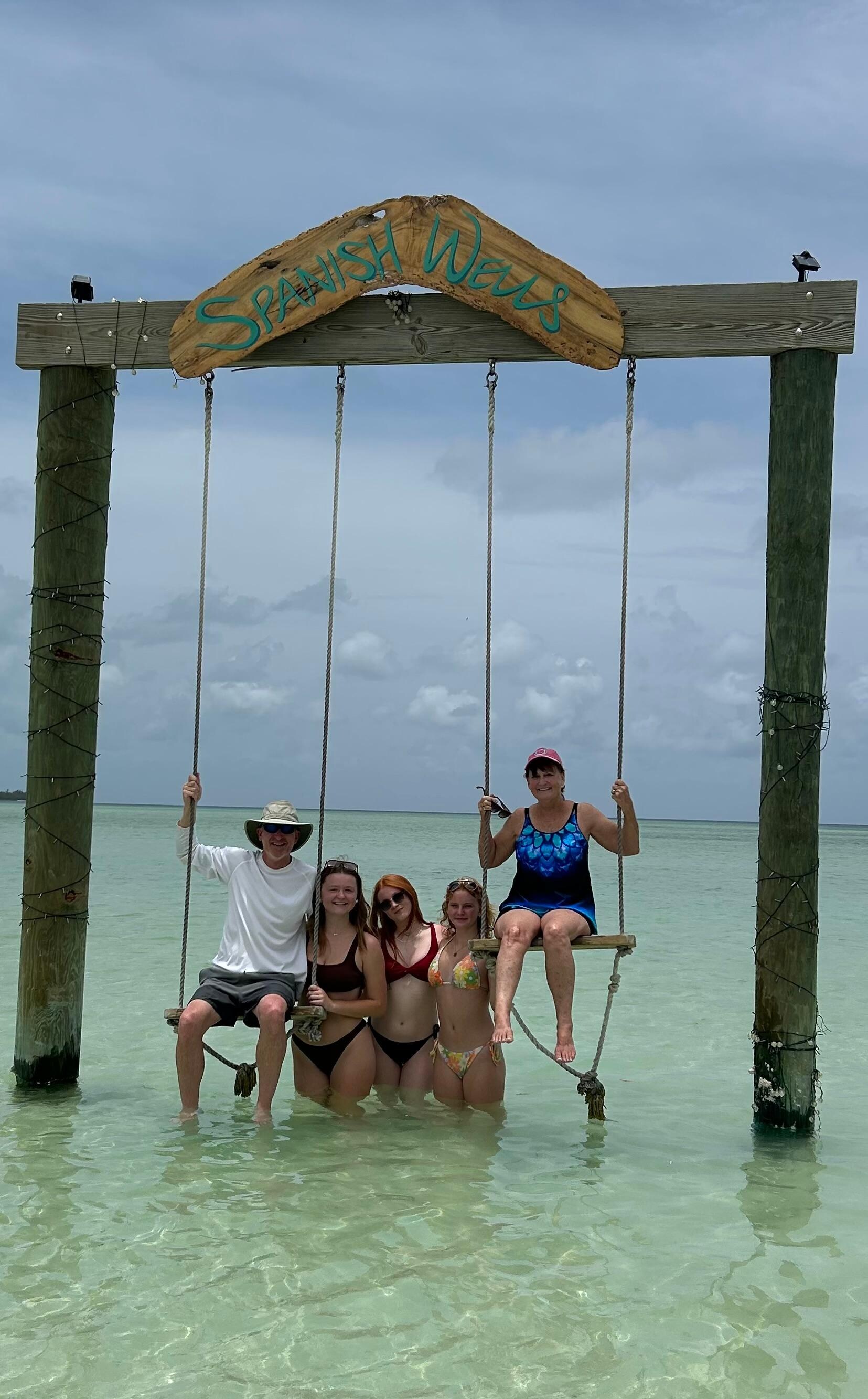 Enjoying the swings at the public beach on the island. 