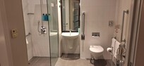 Bathroom with walk-in shower (no step)- shower seat