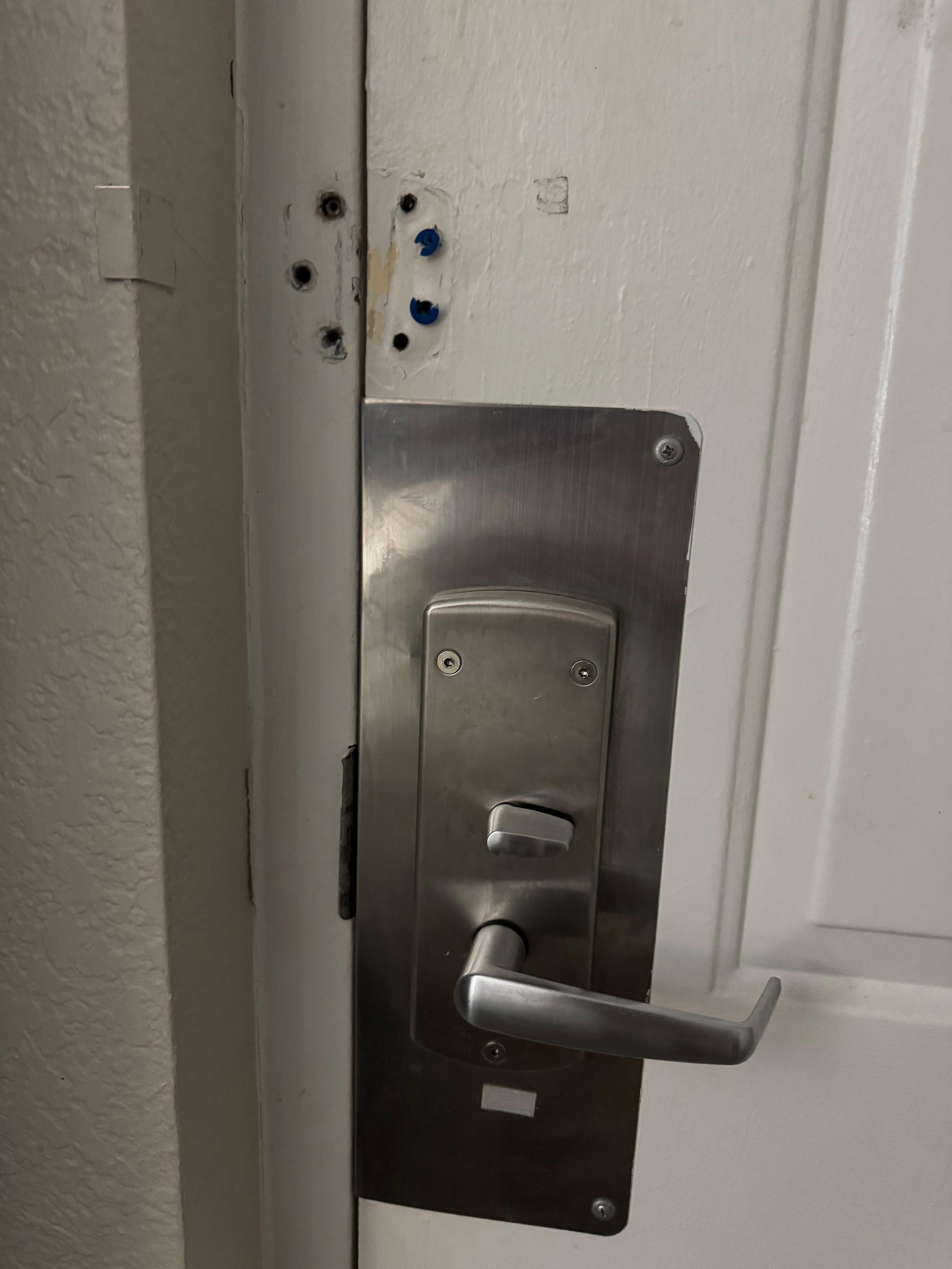 Hold in door, door hard to open and close. No chain lock.