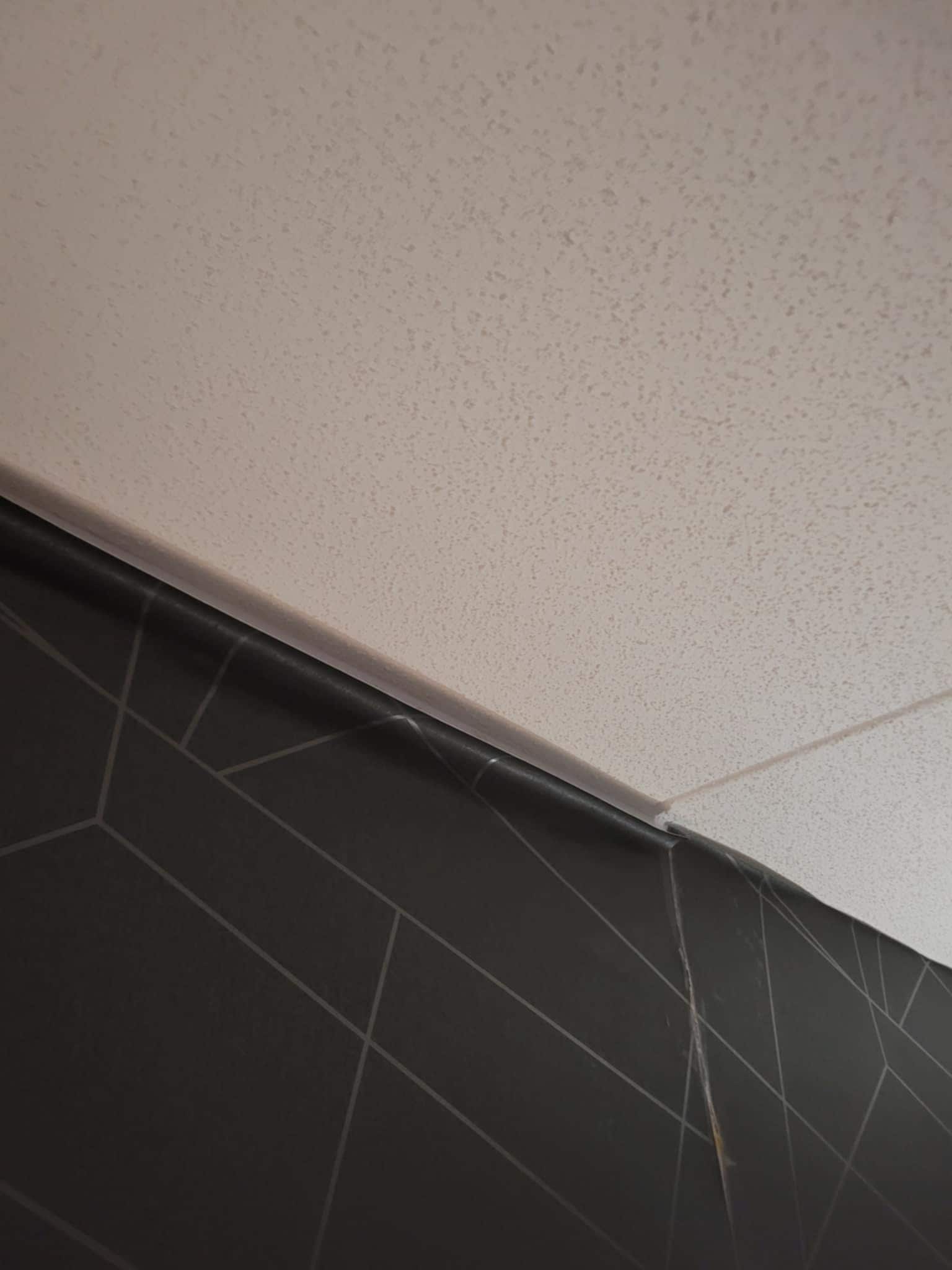 Peeling wallpaper in our nearly $200 a night room.