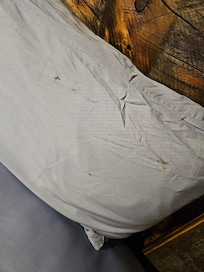 Pillow and sheets were stained with unknown residue. We decided to sleep on top of the blankets because of this