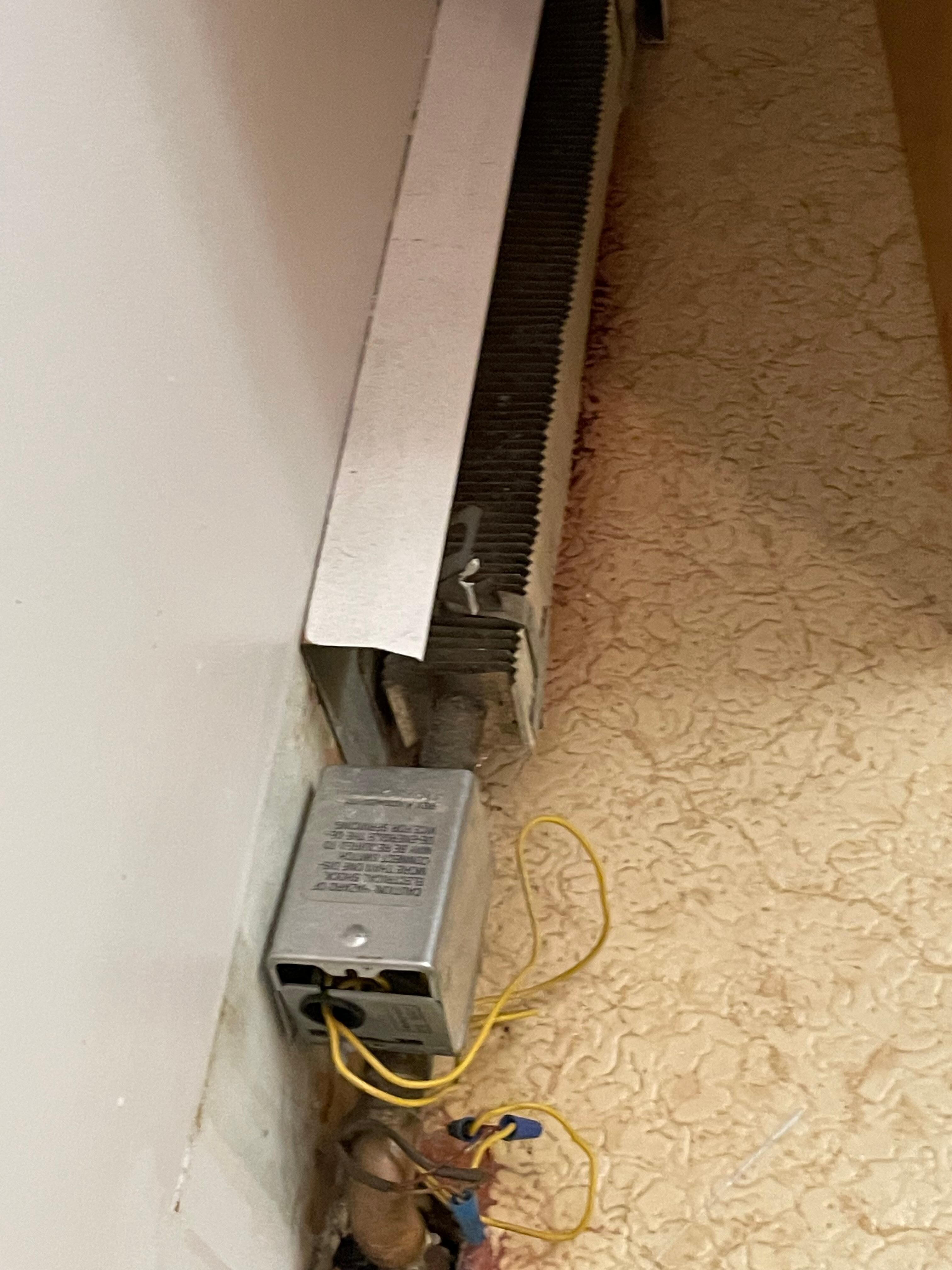 exposed electrical wiring on the heating unit