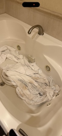 Dirty wet smelly towels on the whirlpool
