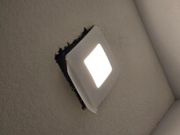 The master bath ceiling fixture hanging, also dropping insulation and dust on toilet