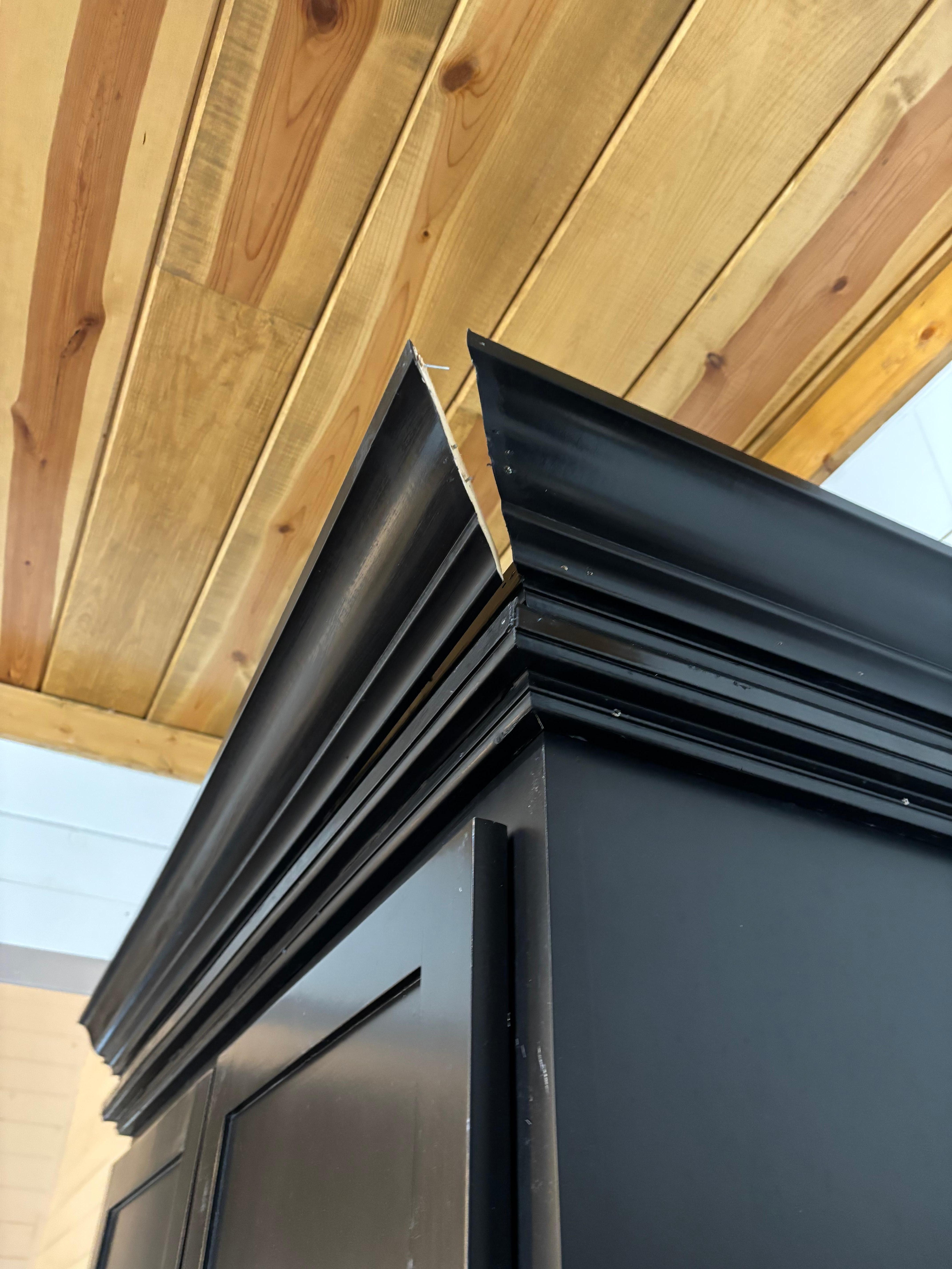 Molding on top of the cabinets coming apart 