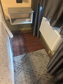 Ac directly in front of bed.