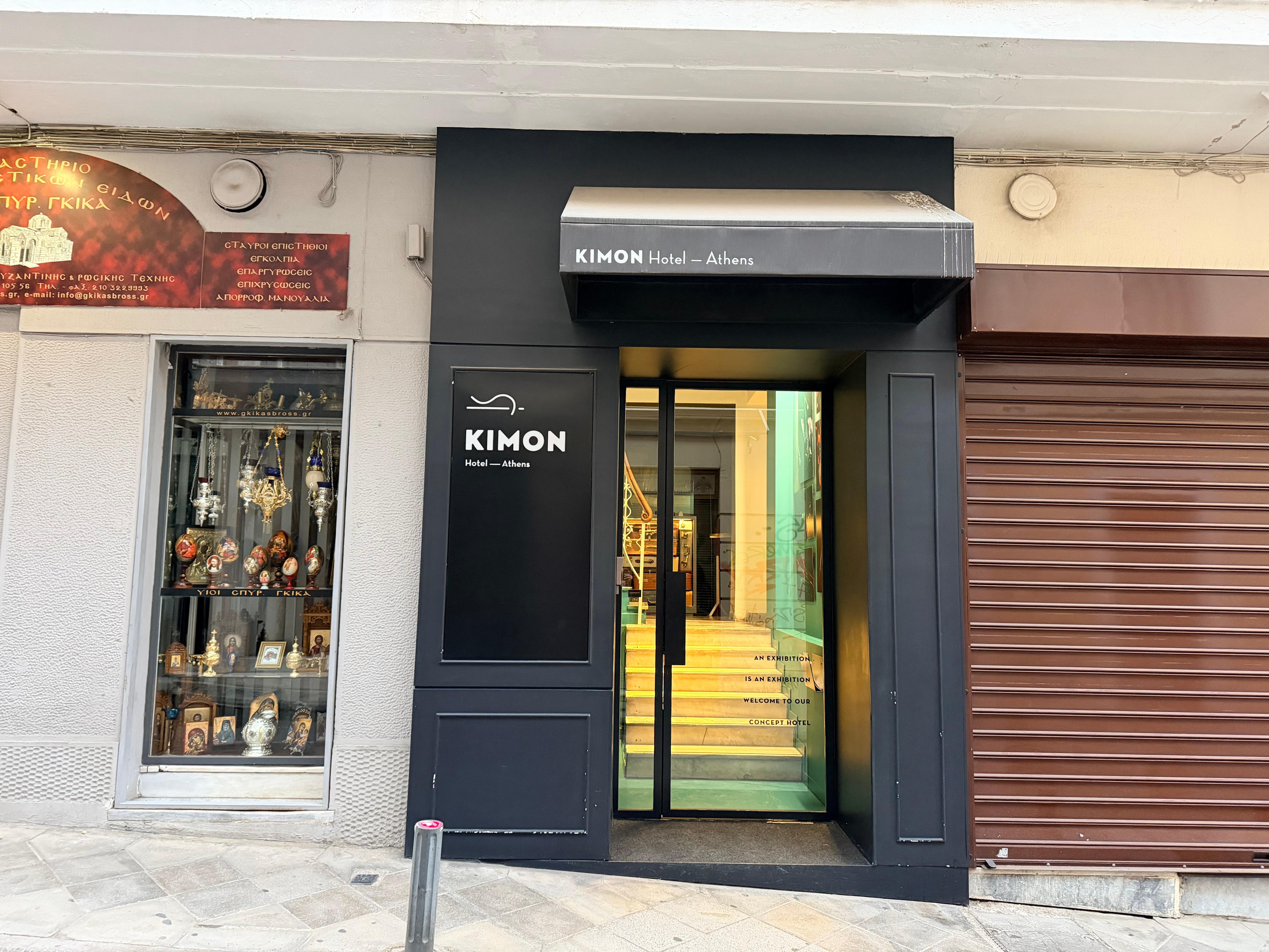 The front door of the hotel is nestled  between other doors, and is easy to miss. 