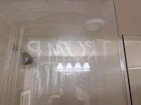 This image was drawn on the shower wall and became visible after showering and humidity made it more visible.