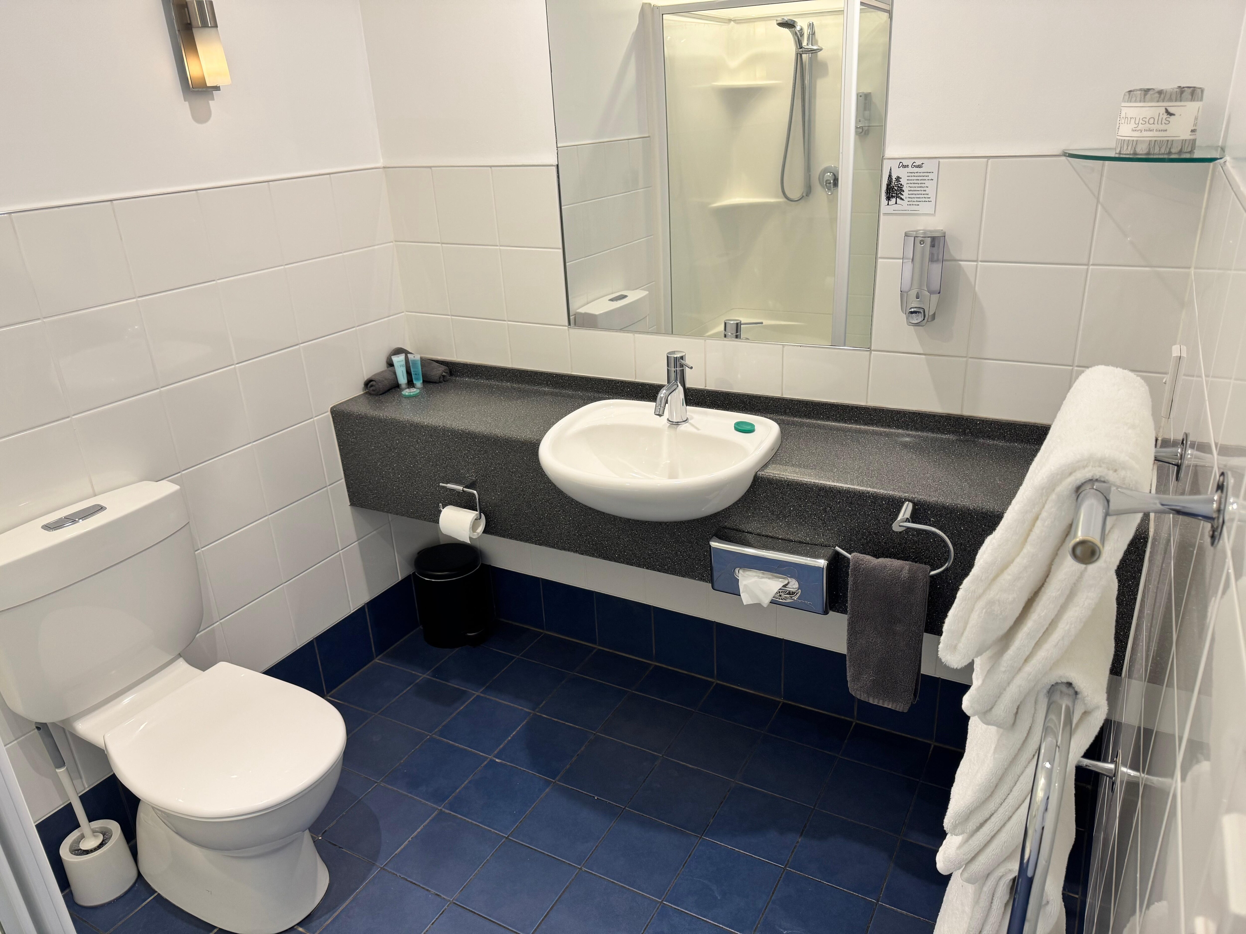 Clean bathroom with plenty thick bath towels. 