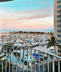 Balcony overlooking the harbor at sunrise