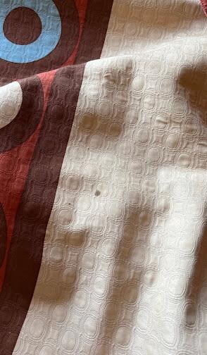 Stained bed top cover, blood?