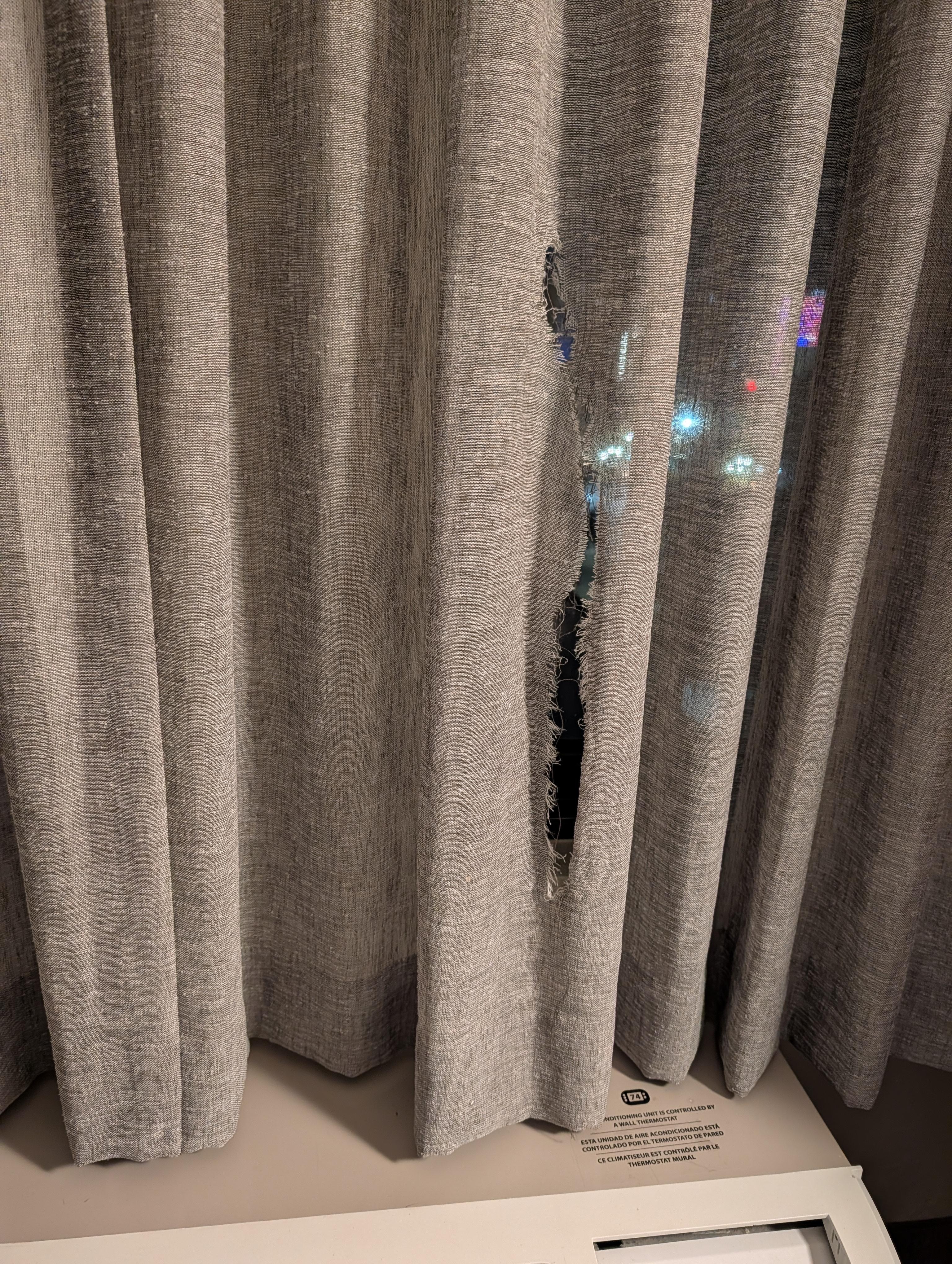 Ripped curtain.