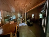 Entry into living room with kitchen and dining table