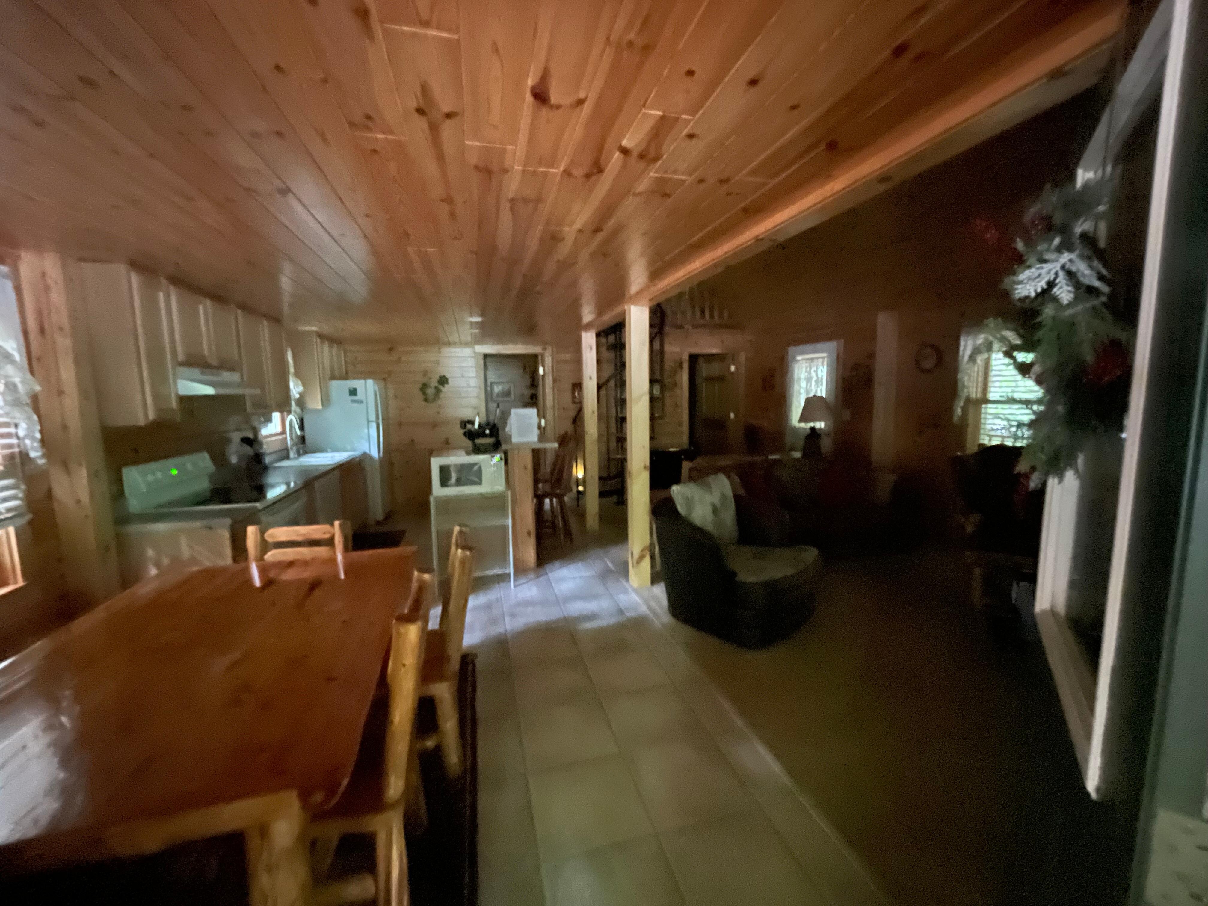Entry into living room with kitchen and dining table