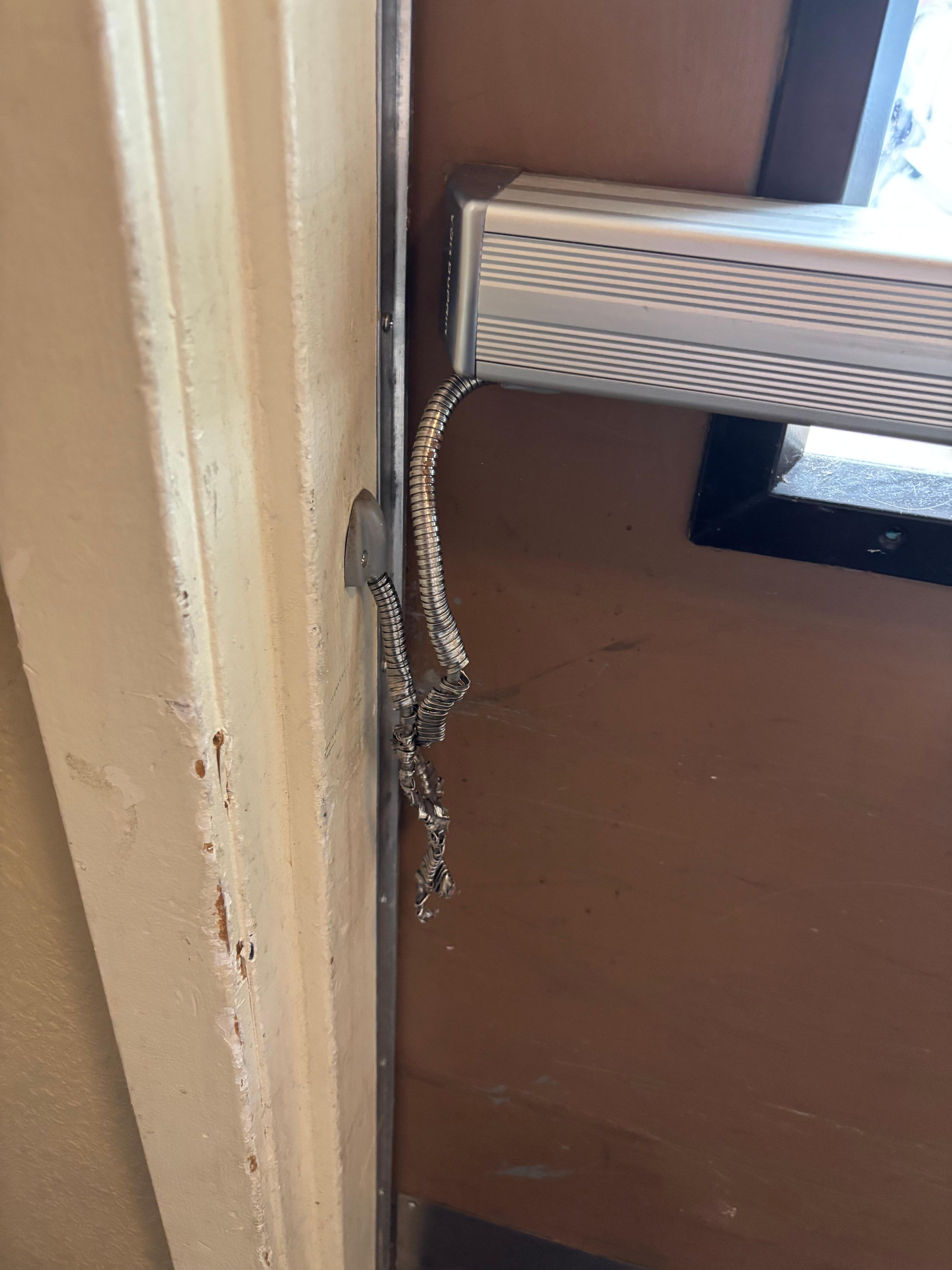 Exterior building key cord, reader disabled by wire cut. Anyone could come and go at his building.