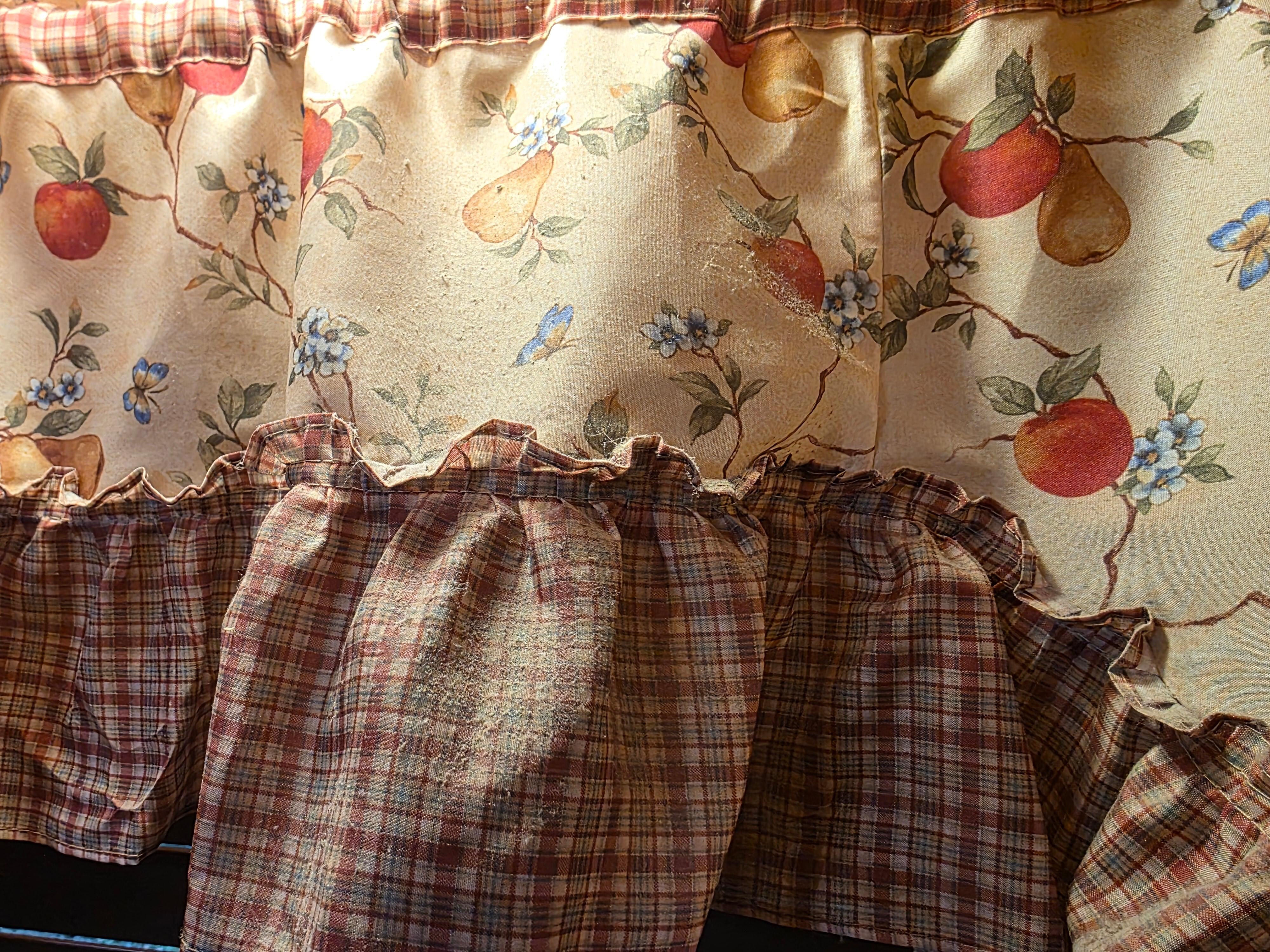 Thick dust on curtain  above sink