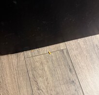 Dirt beside the bed and dirt on the metal black part of the bed