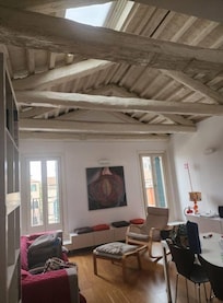 The living area with balcony access.