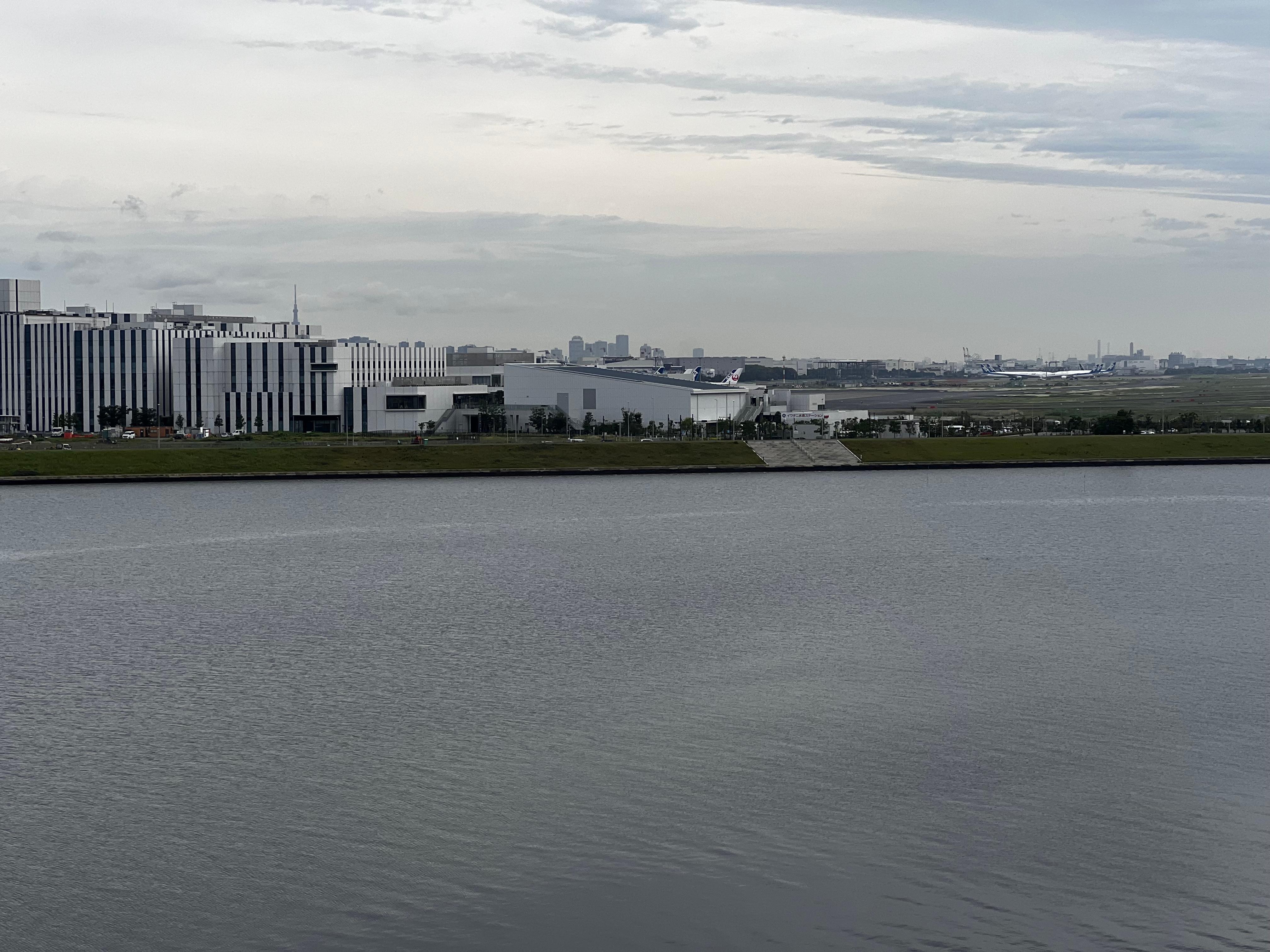 Haneda airport across the river from the balcony off the dining room of the hotel