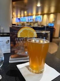 Nice orange fizzy drink with multiple sports on many tvs