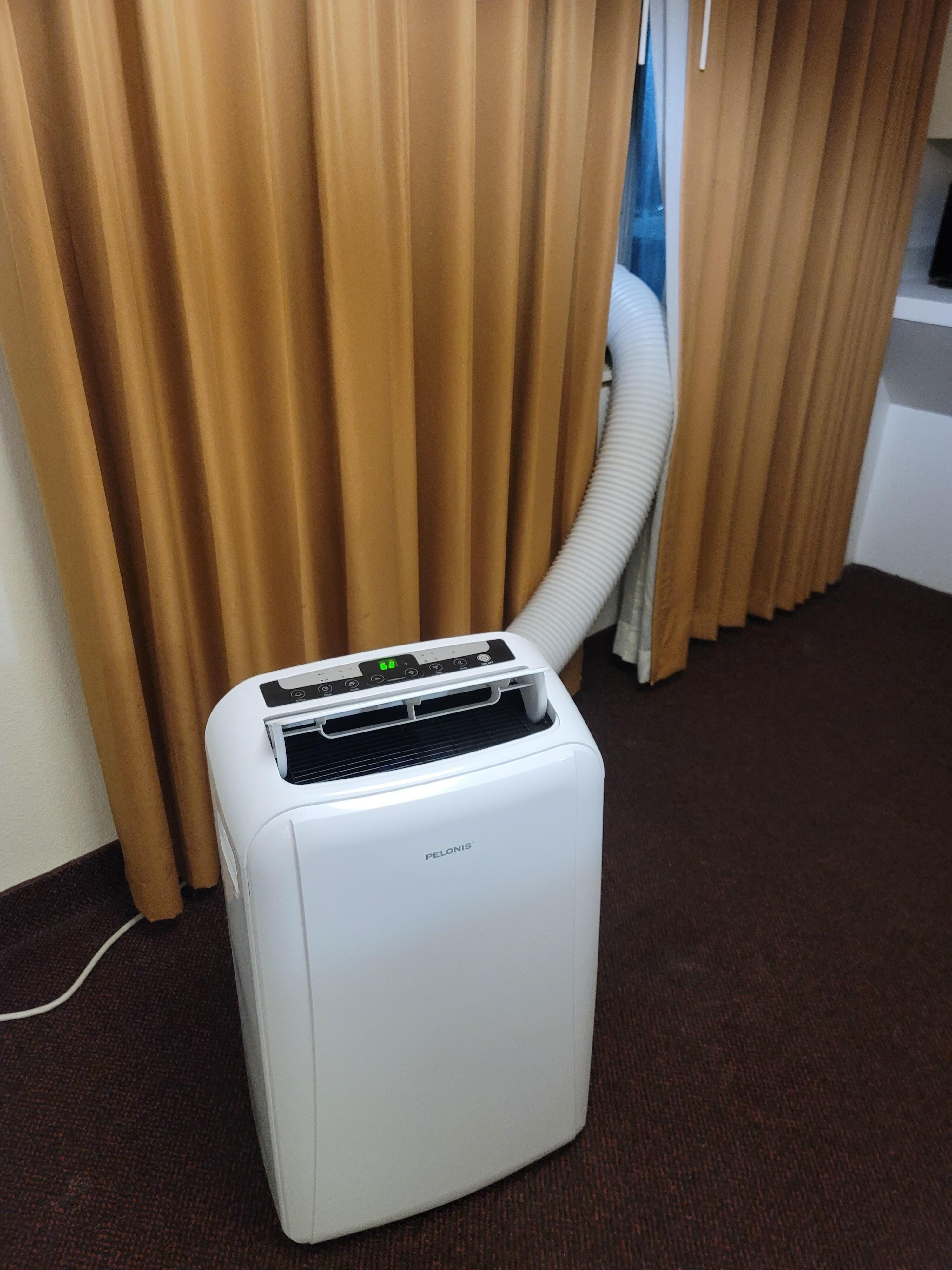 External AC which left 2nd floor window unsecure and wasnt strong enough to cool whole room - could only keep front room lukewarm and separate bedroom was boiling hot. 