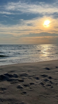 Sunset view from waterfront access at bottom of stairs.