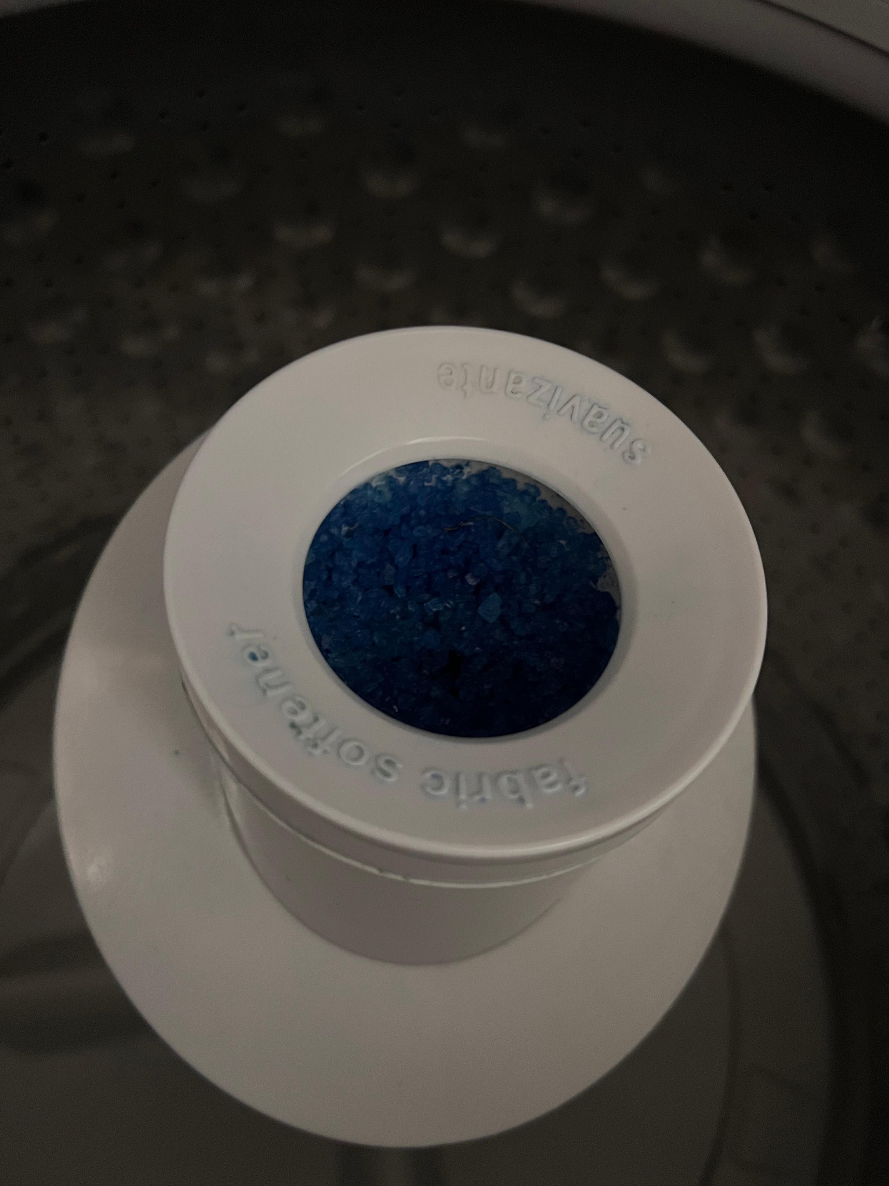 Hardened fabric softener inside wash machine