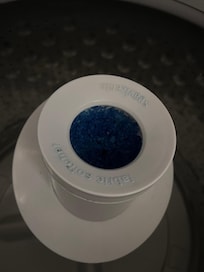 Hardened fabric softener inside wash machine