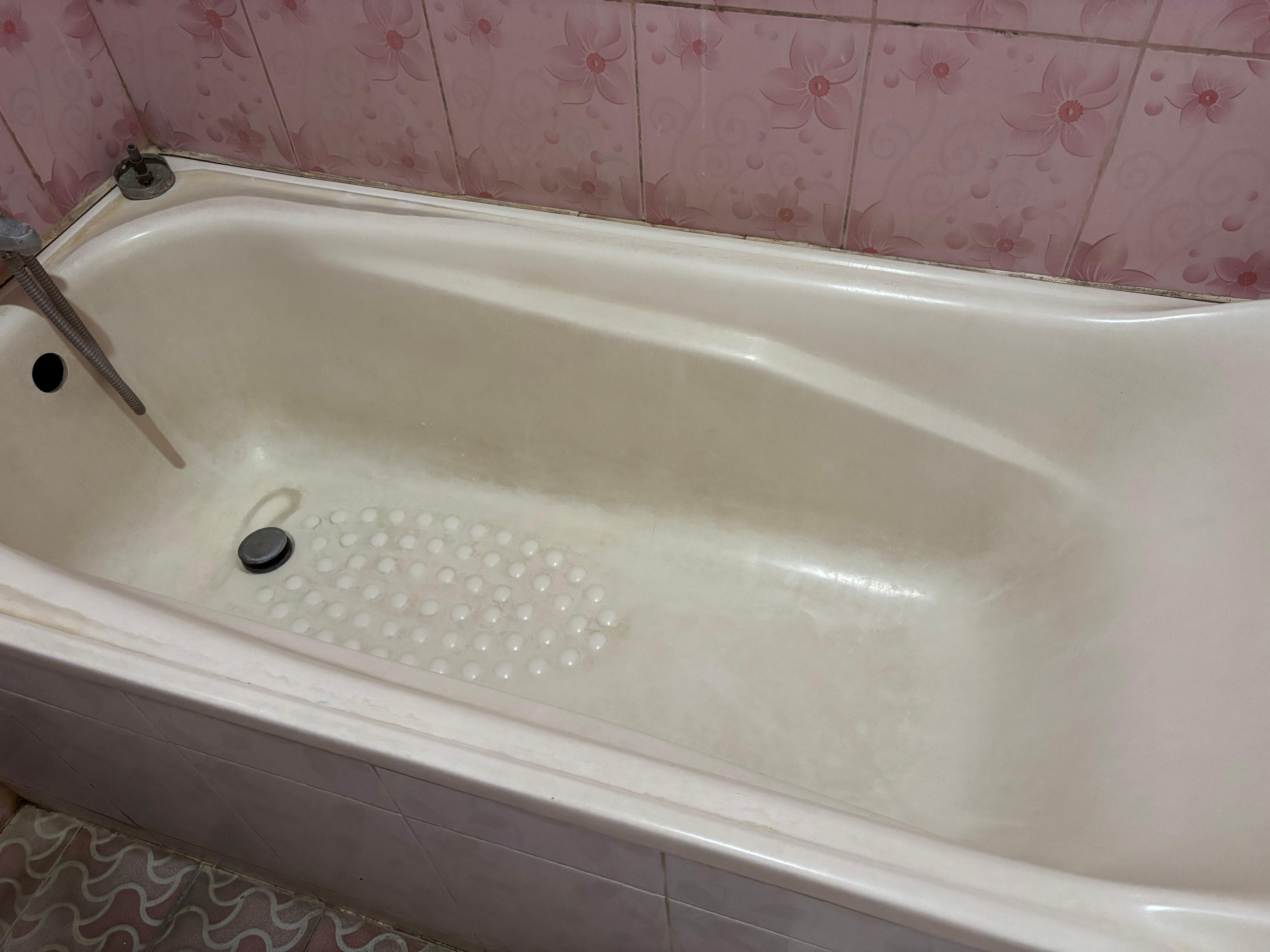 Bathtub needs a good clean to remove stains / grime 