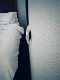 Loose thermostat on the wall.