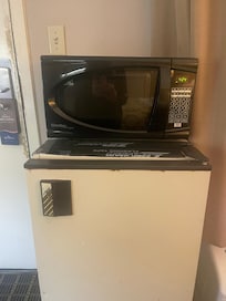 Microwave was completely rusty along with the ancient fridge