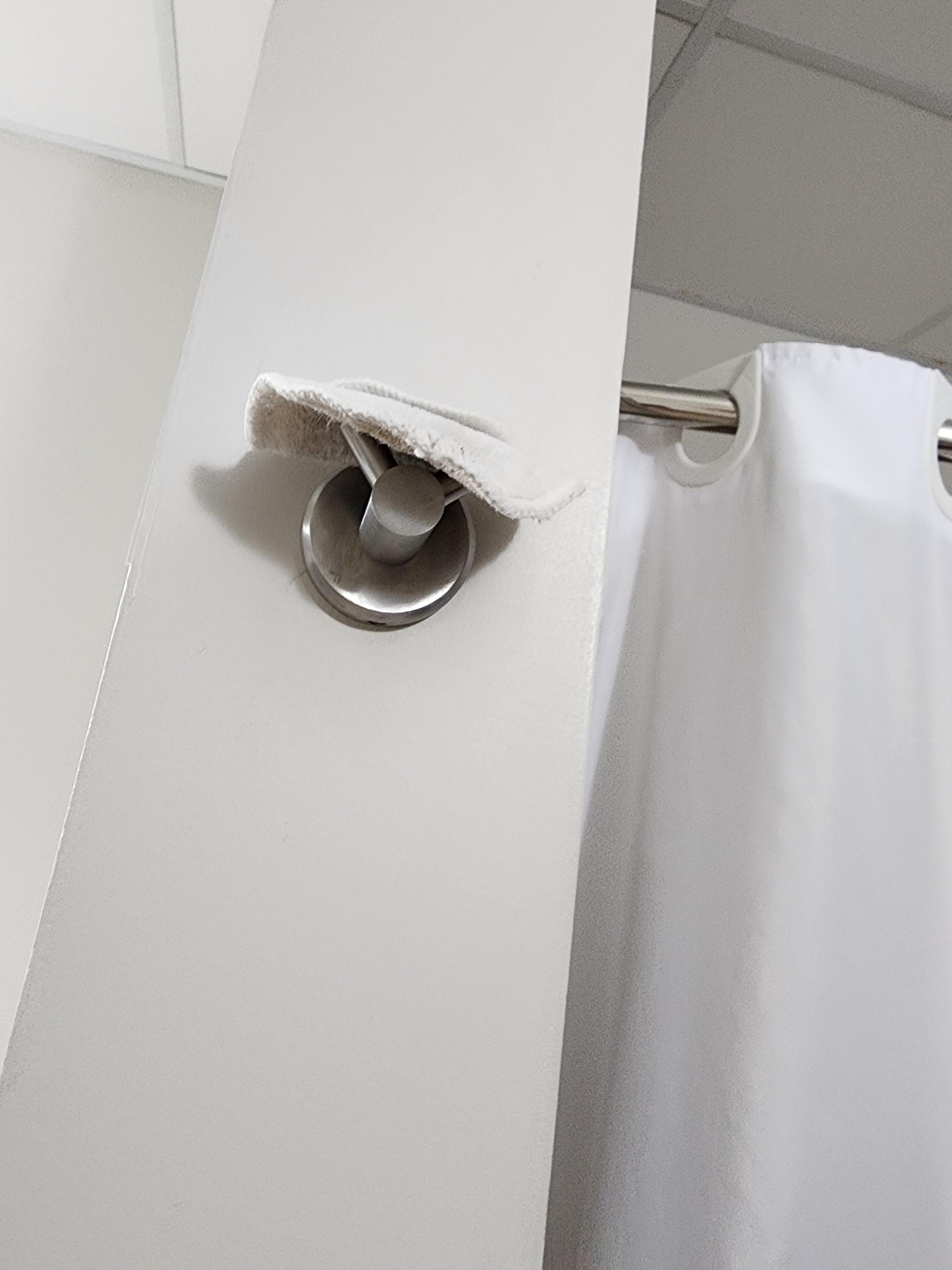 Used makeup remover left on towel hanger