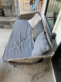 Couch on the porch - literally falling apart