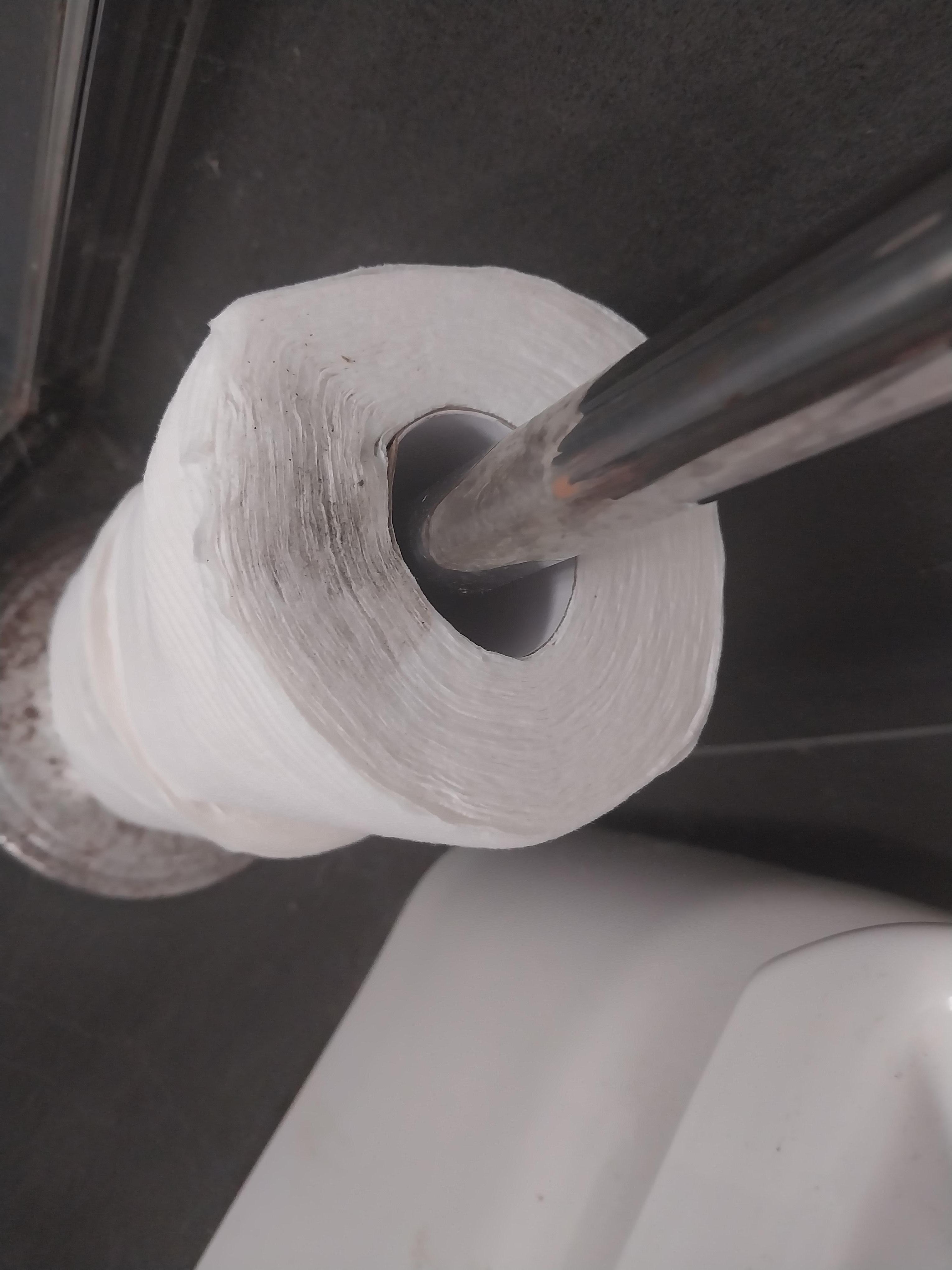 Dust covered spare toilet rolls