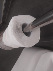 Dust covered spare toilet rolls