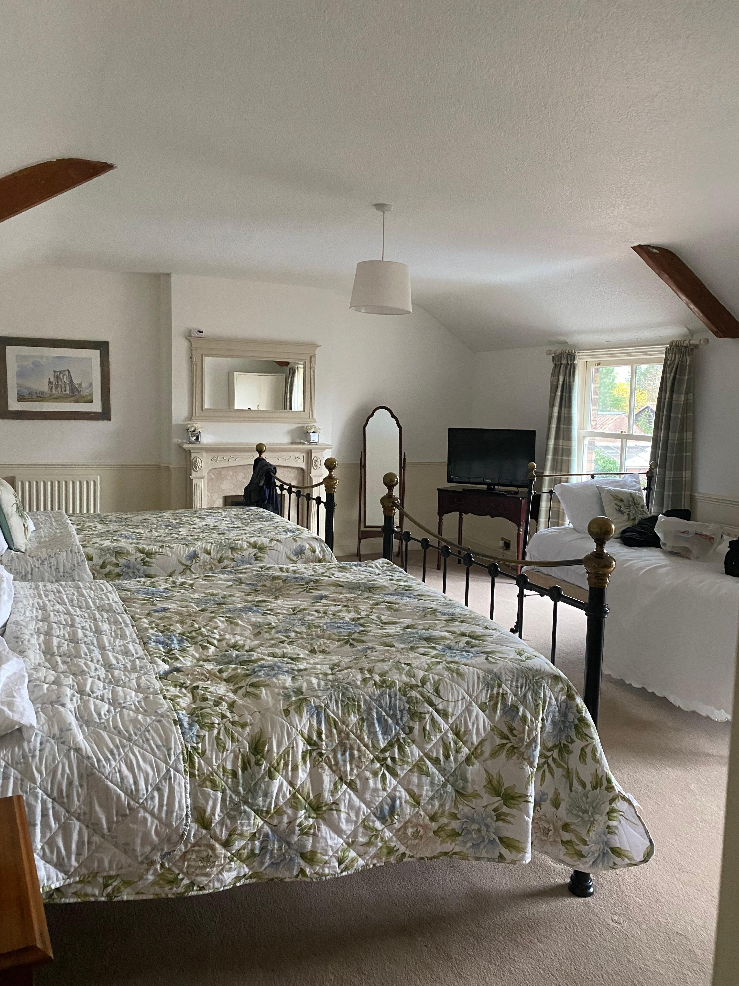 Lovely sized room with two double beds and a day bed