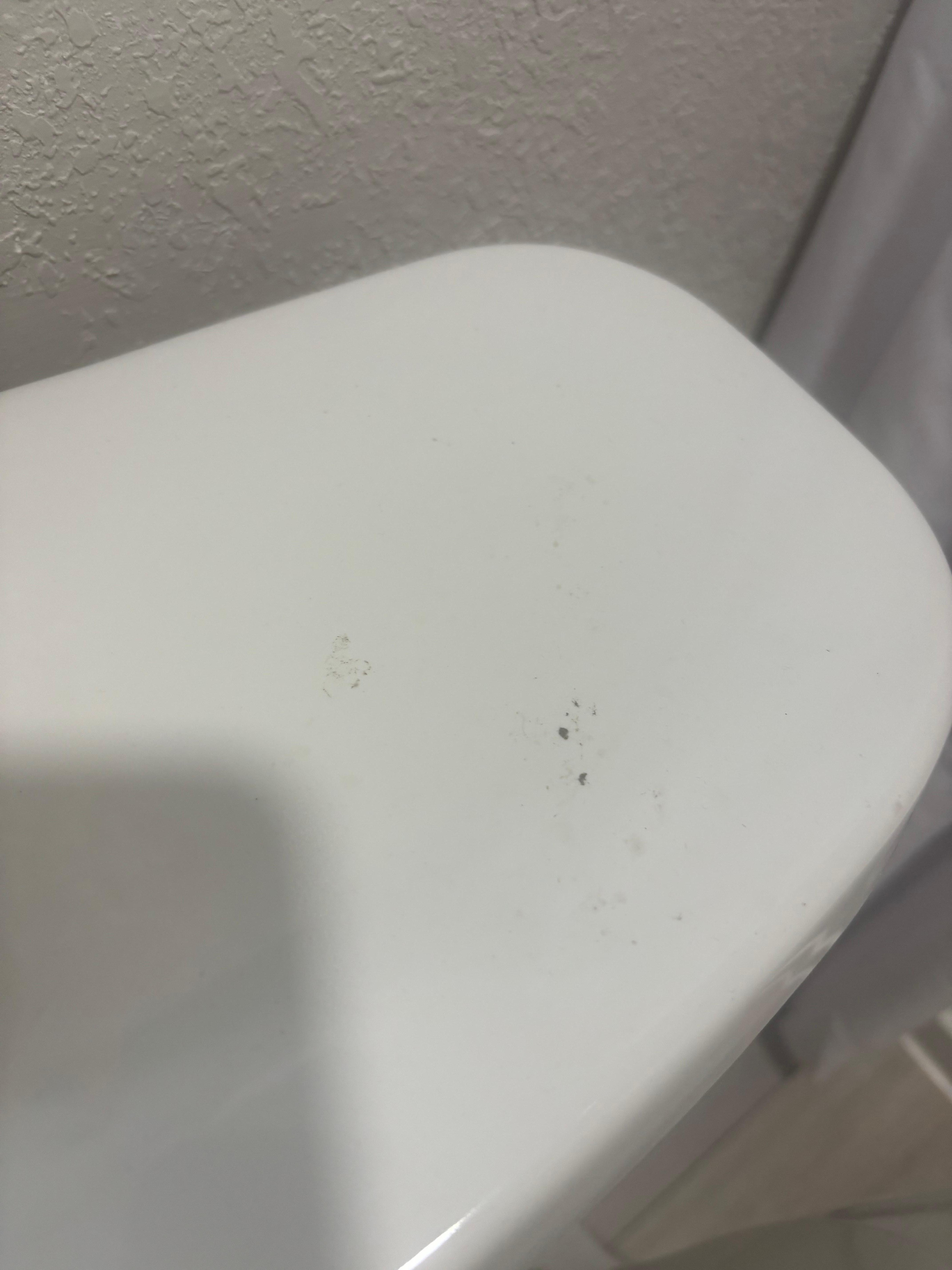 On top of the toilet 