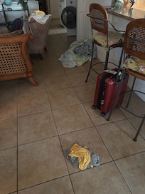 The living room my family and I walked into. The beds had dirty sheets and un-made, the fridge had shaved hair pieces. And the room downstairs was open and had a foul smell, we bought candles.