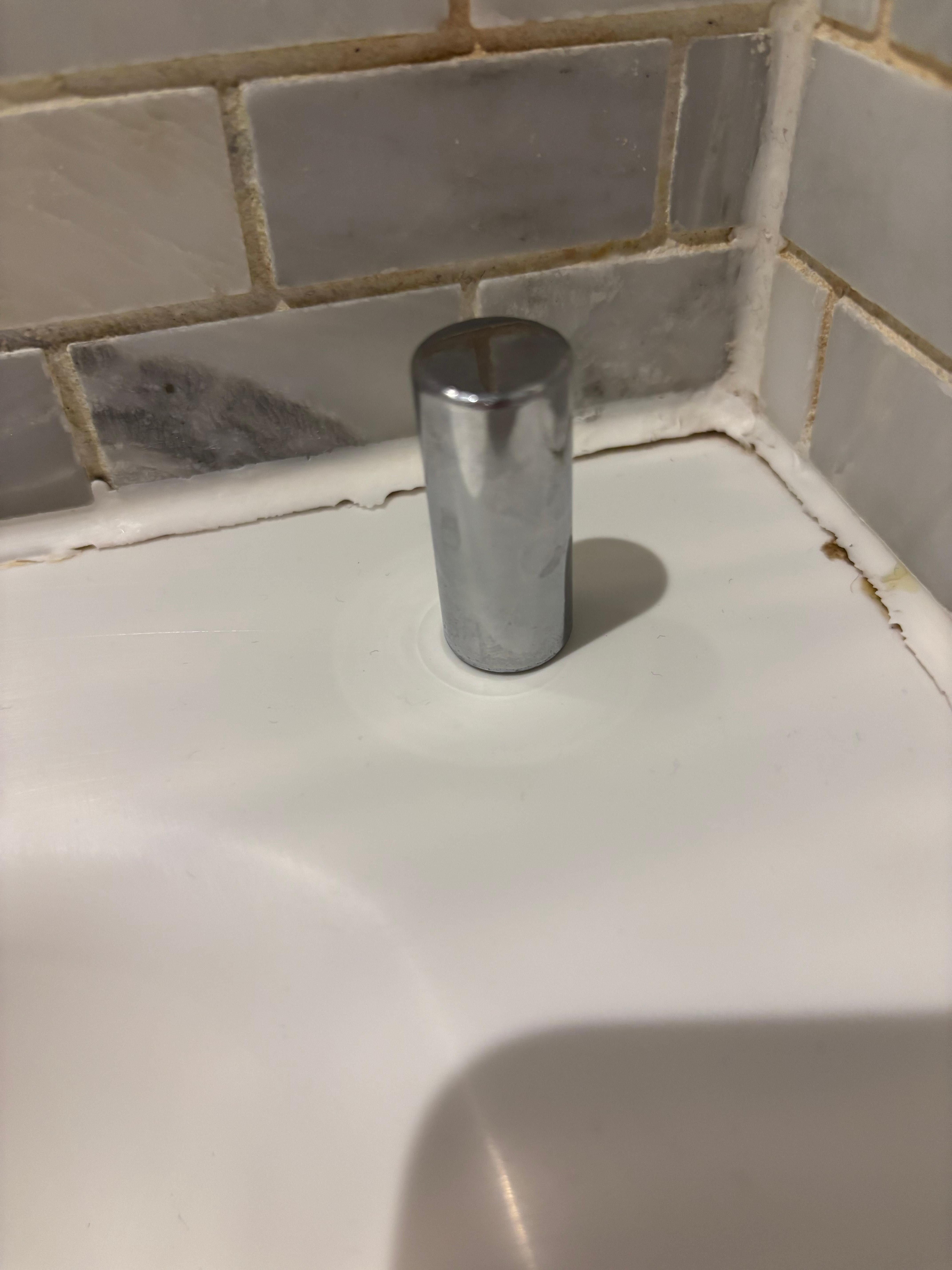 The piece of flying metal and the dirty grout. 