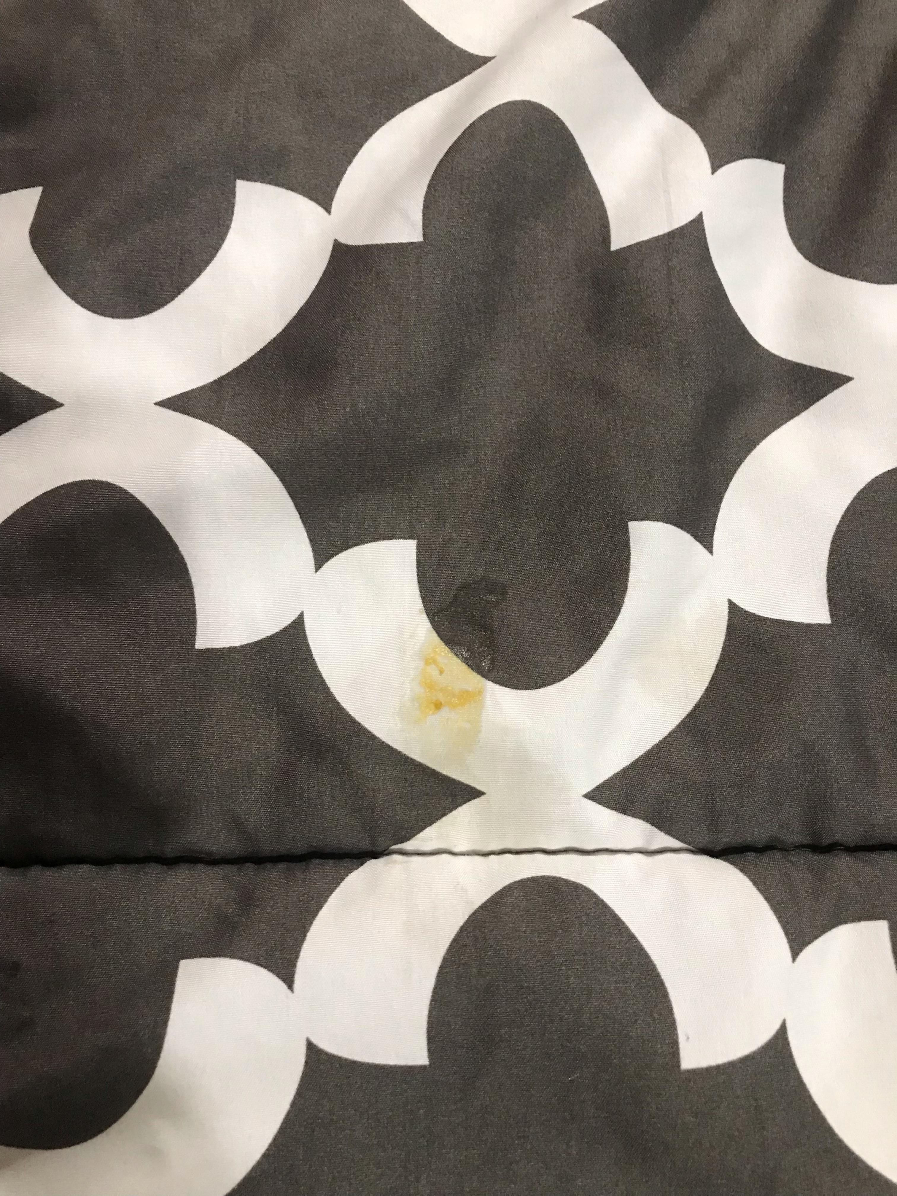 Splotch of “something” on one of the comforters