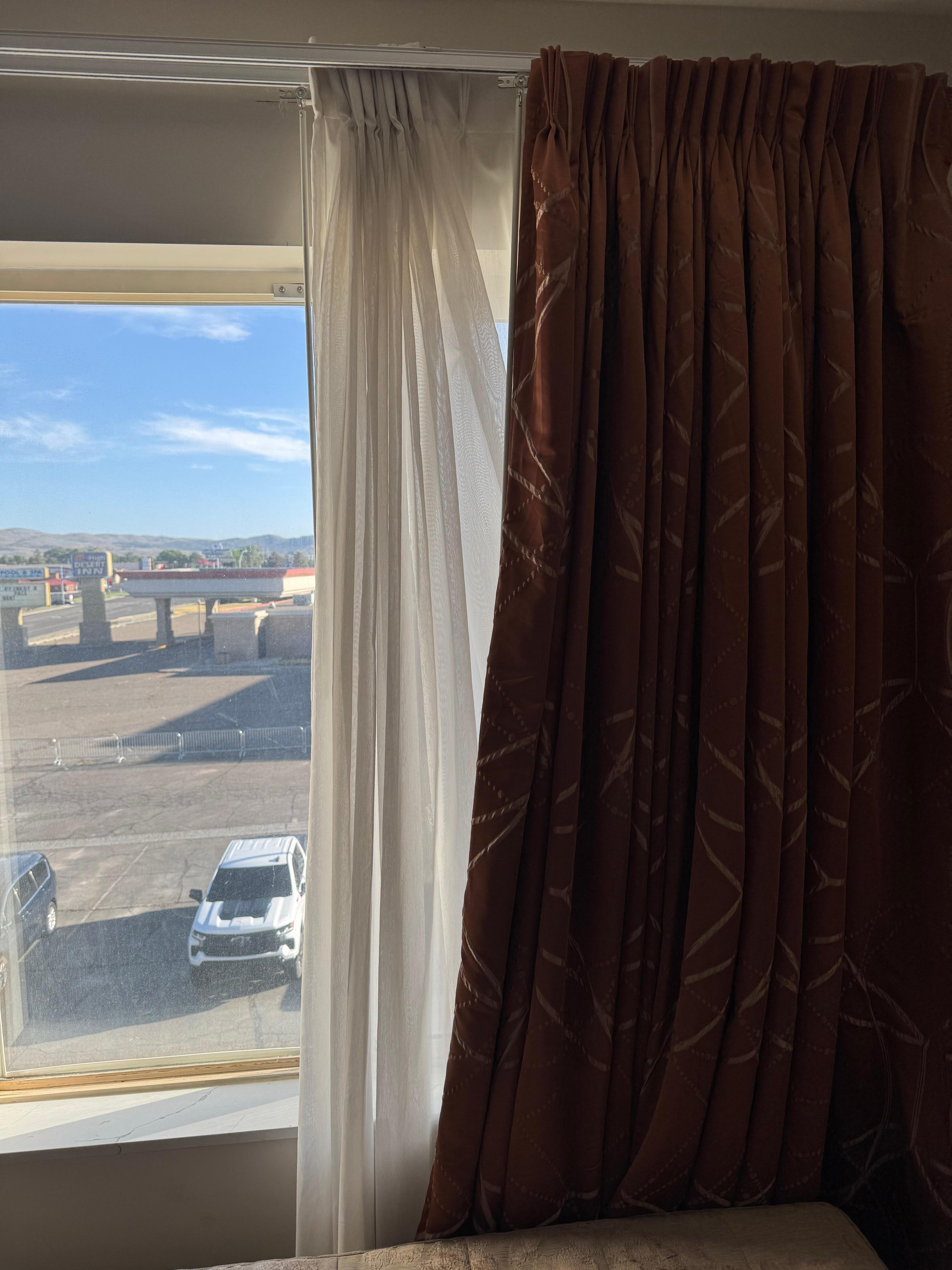 Curtain was in disarray and the curtain at the bottom was on the couch, so it looked like someone had been using the room