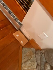 Trim that just fell off the wall next to the fireplace